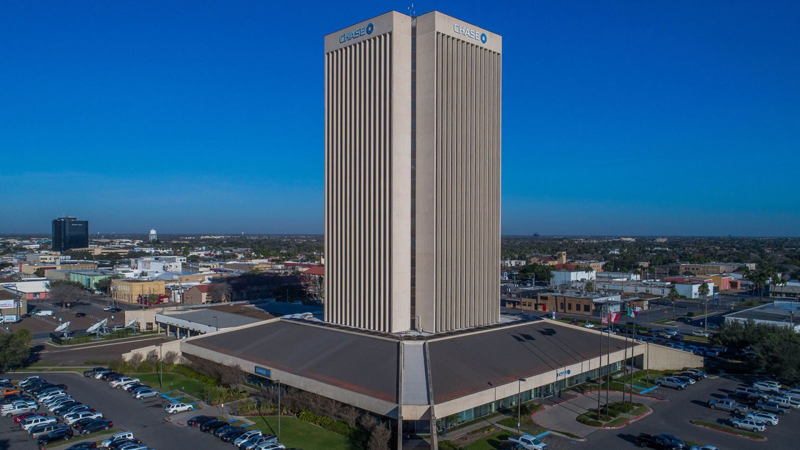 Drone view of the Chase tower and downtown McAllen under a clear blue sky