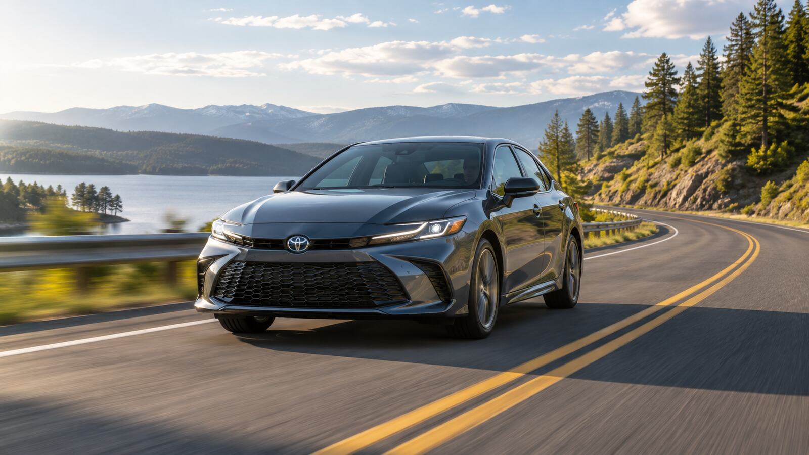 A sedan driving along an open road.